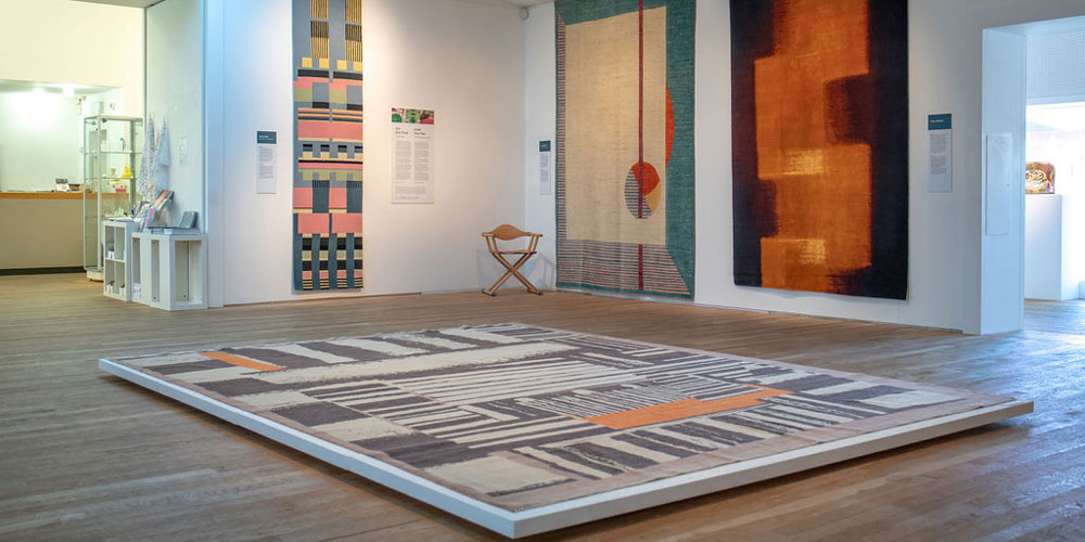 Installation shot of ‘Under Your Feet’ contemporary rugs on show at the Ruthin Craft Centre, north Wales, 6 April–14 July 2019.
