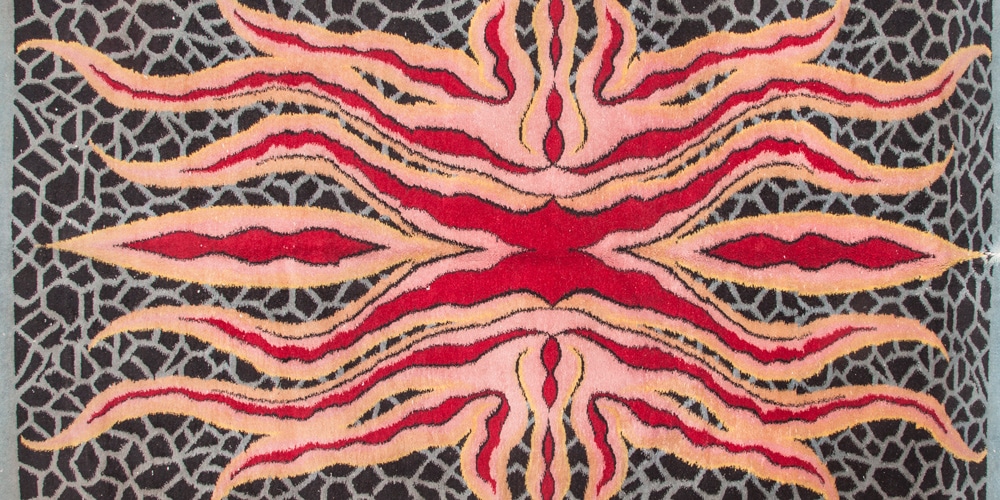 Detail of a rug with a psychedelic starfish pattern