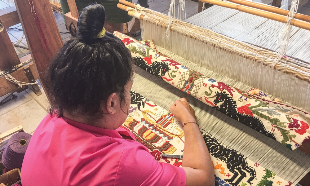Weaver making bagas tapestry at the Su Trobasciu cooperative of weavers in Mogoro