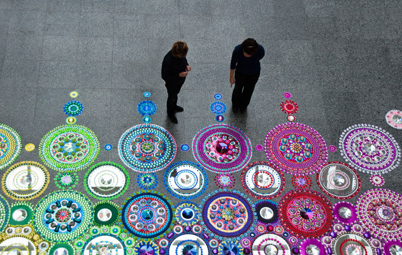 5 viewers interact with the large-scale work